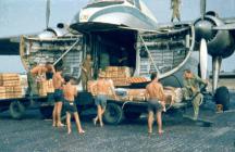 1965 RAF Kuching - loading up for an operational supply drop over Sarawak. G. Thompson on the right.