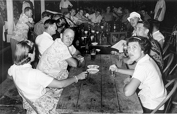 1960: A 41 Squadron happy hour at Telok Paku Leave Centre. Me in white hat.