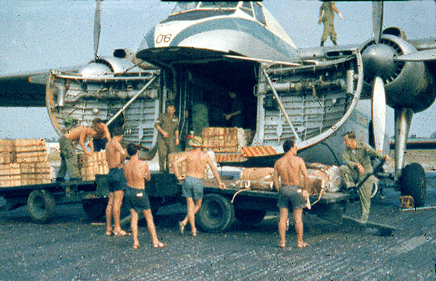 1965:  Loading for a Drop Mission over Sarawak.  Gordon Thompson on right